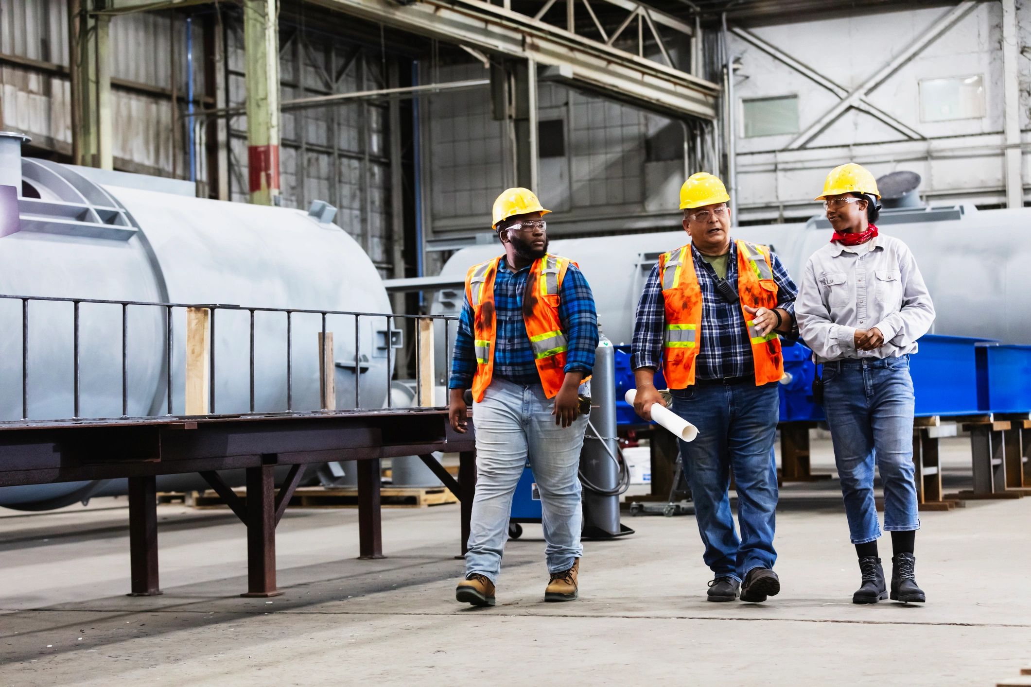 Blue-collar workers talking together at a job site